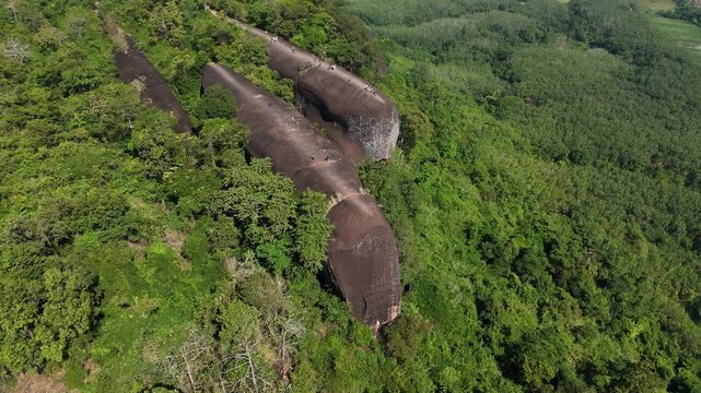 Aerial view of an iconic Three Whales Rock (in Thai called Hin Sam Wan) a 75-million-year-old rock formation protruding out of a mountain in Phou Sing, Bueng Kan Province, Thailand.