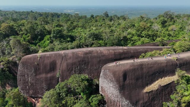 Aerial view of an iconic Three Whales Rock (in Thai called Hin Sam Wan) a 75-million-year-old rock formation protruding out of a mountain in Phou Sing, Bueng Kan Province, Thailand.