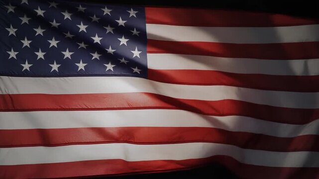 Star Patterned Striped Flag Waving Gently in Dramatic Low Light