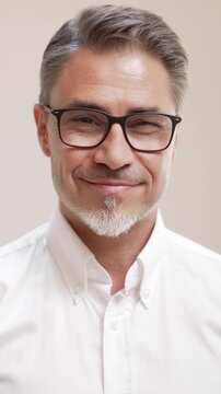 Middle age businessman in white business shirt. Casual entrepreneur. Portrait of mid adult, mature age man, happy smiling. Isolated on white, copy space.