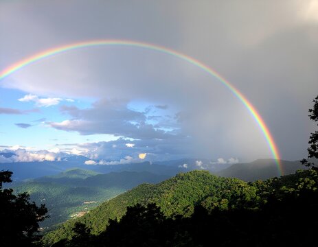 Beautiful landscape photo of the Sahyadri mountain range with a rainbow seen