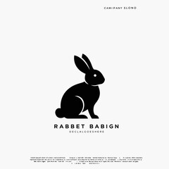 Fototapeta premium Minimalist Black Silhouette of a Sitting Rabbit Facing Left with Company Name and Text Below