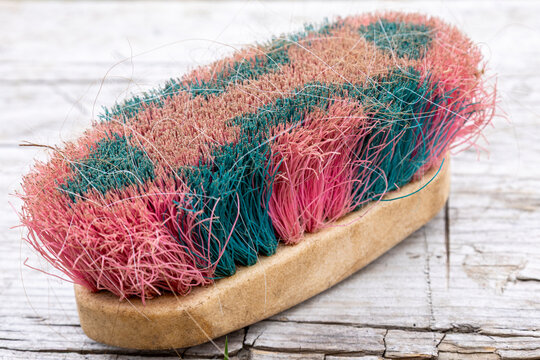 Worn Horse Grooming Brush on Wooden Surface