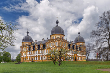 Three quarter view of Schloss Seehof in Memmelsdorf Germany. Baroque palace facade under cloudy overcast sky © borisb17