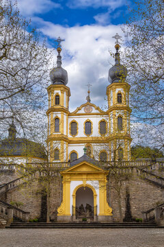 Scenic view of Kappele Pilgrimage Church and stairs in Wurzburg Germany. Baroque Wallfahrtskirche facade under partly cloudy sky