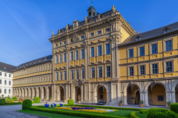 Obraz premium Front view of Stiftung Juliusspital hospital in Wurzburg Germany. Historic Baroque palace facade under clear blue sky