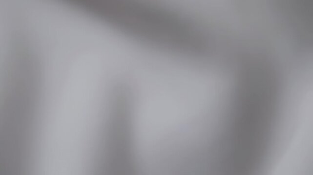 Flowing white fabric texture close up