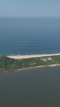 Florianopolis in Santa Catarina. Aerial view, Peri Lagoon and Caldeir&atilde;o Beach. Vertical video.