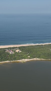 Florianopolis in Santa Catarina. Aerial view, Peri Lagoon and Caldeir&atilde;o Beach. Vertical video.