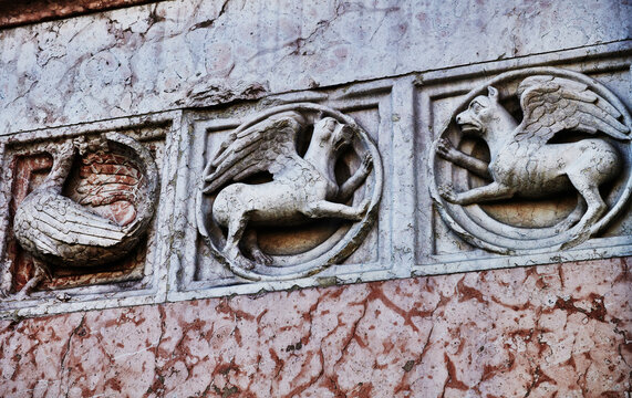 Bas-relief carvings on the exterior of the Baptistery of San Giovanni (Battistero di Parma), built in the 12th century in Parma, Italy, Europe 
