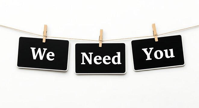 We Need You recruitment message on black cards, hiring announcement hanging on clothesline, job vacancy and career opportunity concept