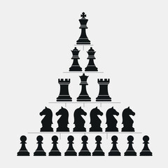 Black chess pieces in pyramid formation. © Majid_Sa'dan