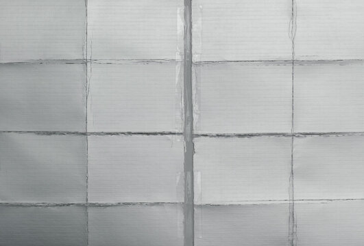 torn reflective silver foil paper repaired with transparent adhesive tape. Minimal metallic texture background with visible seams, wrinkles, and industrial geometric structure.