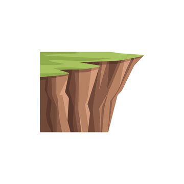 Cliff edge with green grass top.