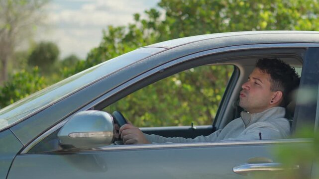 Anxious Male Driver Breathing Heavily During Panic Attack Inside Parked Car