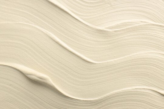 Natural clay paste for hair and skin care as background, top view. Mud therapy