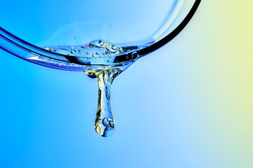 Skin microbiome serum dropping from glass surface © Marevgenna