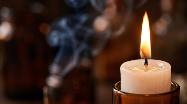 Single lit white wax candle flame, melted wax pool and flame, meditation space with incense smoke