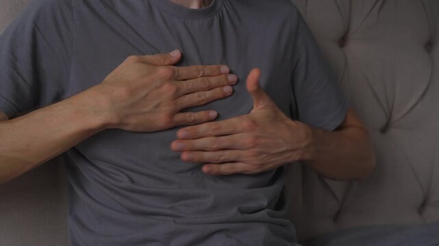 Man hitting his chest with open palms, high quality uncompressed audio recording. Rhythmic body impact sound and expressive gesture. Emotion, intensity and everyday human behavior concept.