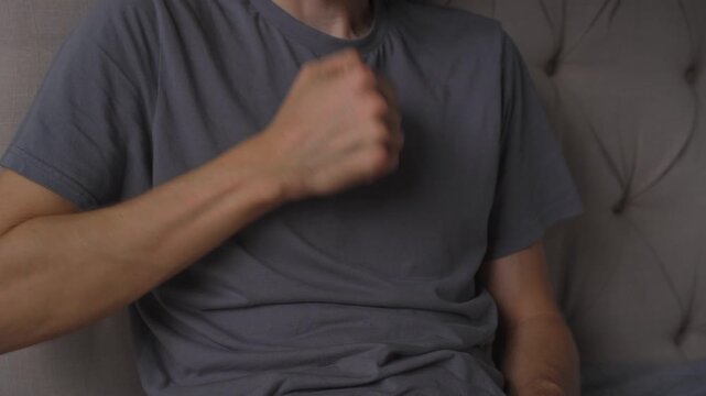 Man beating his chest with fist, high quality uncompressed audio recording. Strong body impact sound and expressive gesture. Emotion, intensity and everyday human behavior concept.
