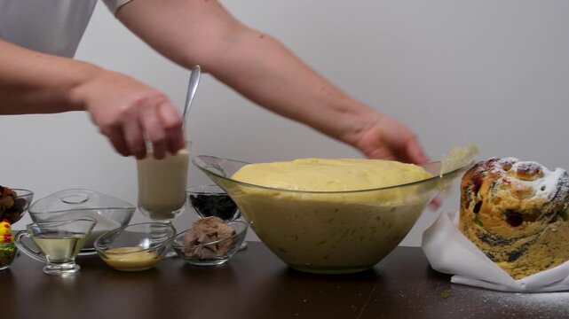 step by step recipe Christmas Easter bread Panettone krafin preparing soft layered Easter cruffin dough dried fruits, orange zest, poppy seeds and butter during homemade sweet bread baking process