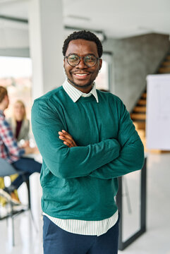 Portrait of a group of young business people having a meeting or training in the office. Teamwork and success concept, portrait of a smart young businessman, student, teacher or coach