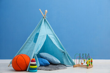 Wigwam, toys and pillows in child's room © New Africa