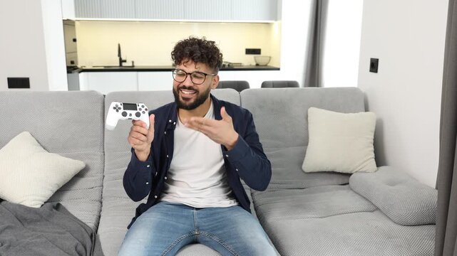 Gamer man holding controller making a funny face