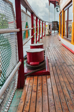 Wooden Promenade Deck and Mooring Bitt on wooden plank deck of a classic a Passenger Ship