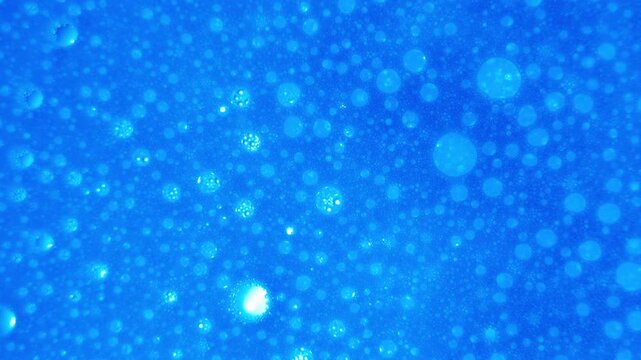 close up of soap bubbles in water. abstract background for cleaning liquid ads or chemical reactions.