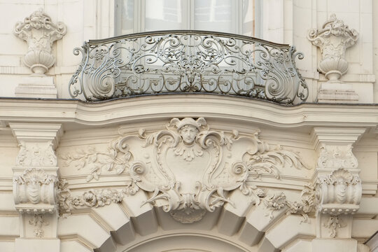 Ornate stone balcony with decorative iron railing