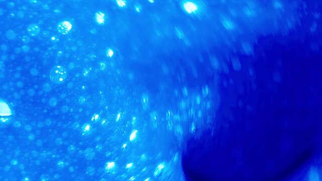 close up of soap bubbles in water. abstract background for cleaning liquid ads or chemical reactions.