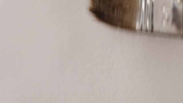 close up of wide natural squirrel painting brush watering the watercolour white paper. Slow motion video for background or overlay