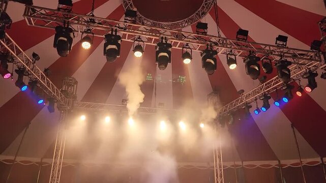 Theatrical stage lighting setup with fog.