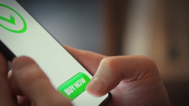 As part of fast online shopping, a man uses his smartphone to confirm an online purchase with a single tap. Immediate payment processing triggers a success notification, showcasing technology's speed