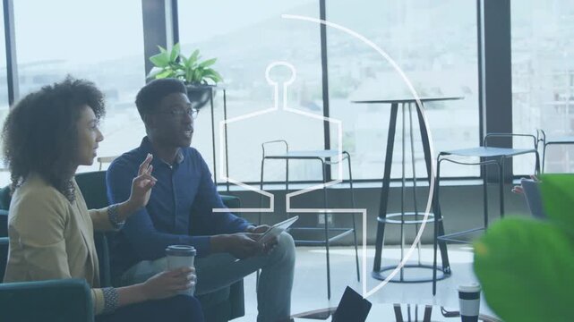 Seated pair holding cup using tablet, animated logo circle overlaying group sparking business ideas