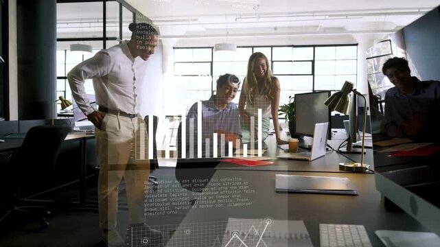Team meeting around desk, seated man tapping laptop causing animated charts showing business growth
