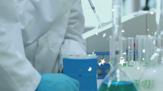Female lab tech using pipet aspirating or dispensing for testing in lab with animated stars over tub