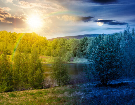 day meet night landscape by the lake. sun and moon over deciduous forest near the glacial lake at twilight. view of primeval forest of carpathian mountains in spring. epic sky. astrology wallpaper