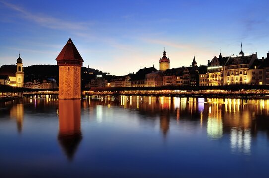 Old town of Lucerne with Kapellbr&uuml;cke bridge, Wasserturm tower and the Reuss river, at dusk, Lucerne, Canton of Lucerne, Switzerland