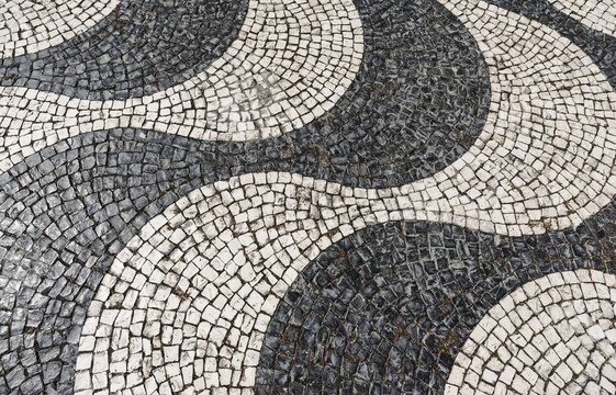 Wavy pattern in pavement, black and white, cobblestones, Rossio, Lisbon, Portugal