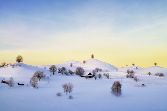 Snow-covered hilly landscape at sunrise, Menzingen, Canton Zug, Switzerland
