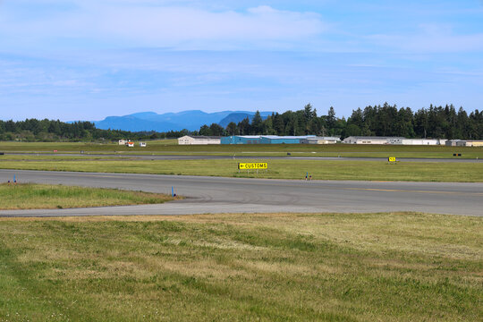 Regional Airport Runway with Commercial and Industrial Buildings