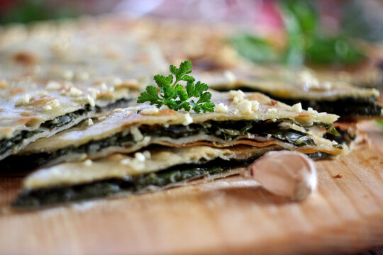 Soparnik - traditional Croatian thin pie made from dough, Swiss chard and onions. Selective focus