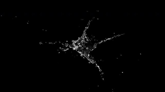 Super Slow Motion of Splashing Water Isolated on Black Background . Filmed on High Speed Cinematic Camera at 1000 FPS