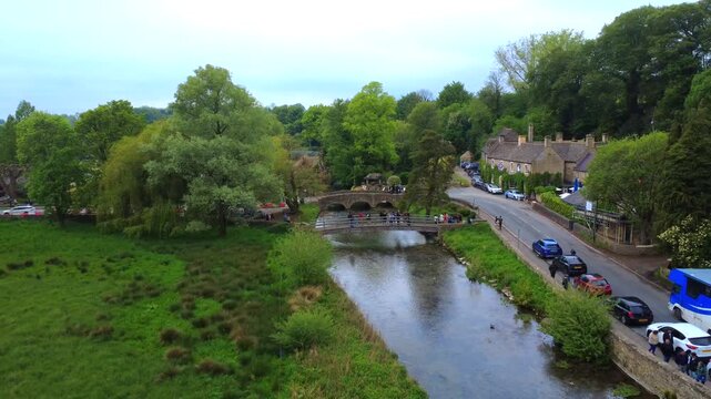 Bibury Bridge and Tourists Cotswolds England 4K