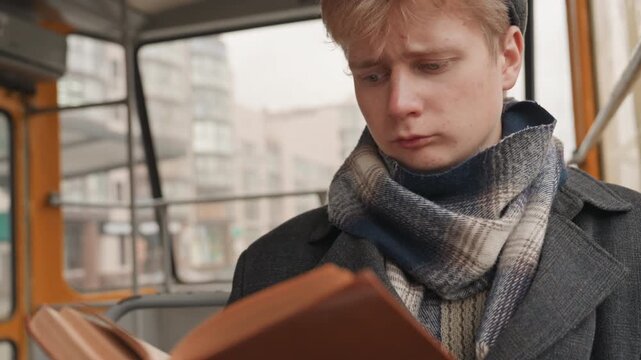 Boy delights in engaging story. Smiling youth engrossed in captivating city story experience. Content young man enjoys exploring and experiencing compelling urban narrative adventures