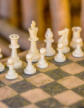White chess pieces positioned on board symbolizing leadership and planning mindset.