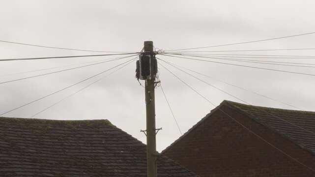 UK telegraph pole with fibre broadband internet installation 8K stock footage