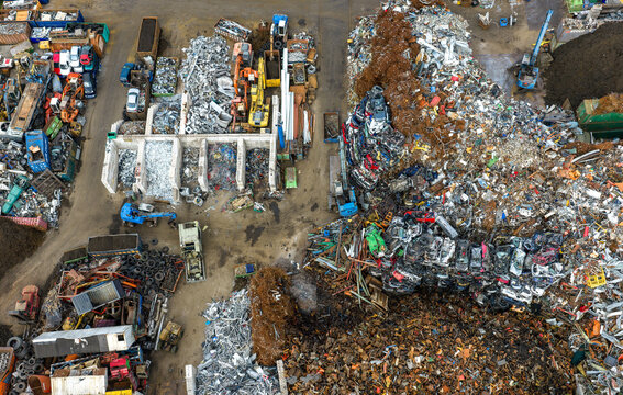 Aerial view of scrapped cars and crushed metal debris piled in a junkyard and recycling site in Hoogeveen, Drenthe, Netherlands.